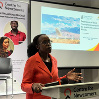 Dr. Marie Claire Uwamahoro presents on her research "Experiences of Black Francophones navigating the healthcare system of Alberta" at the Centre for Newcomers collaborative Health Navigation workshop in July 2025.