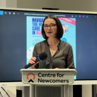 Doreen Rabi at the podium at the Centre for Newcomers